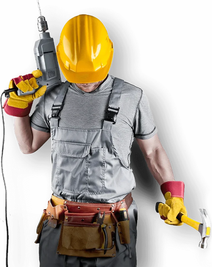A technician with a hard hat and a power drill