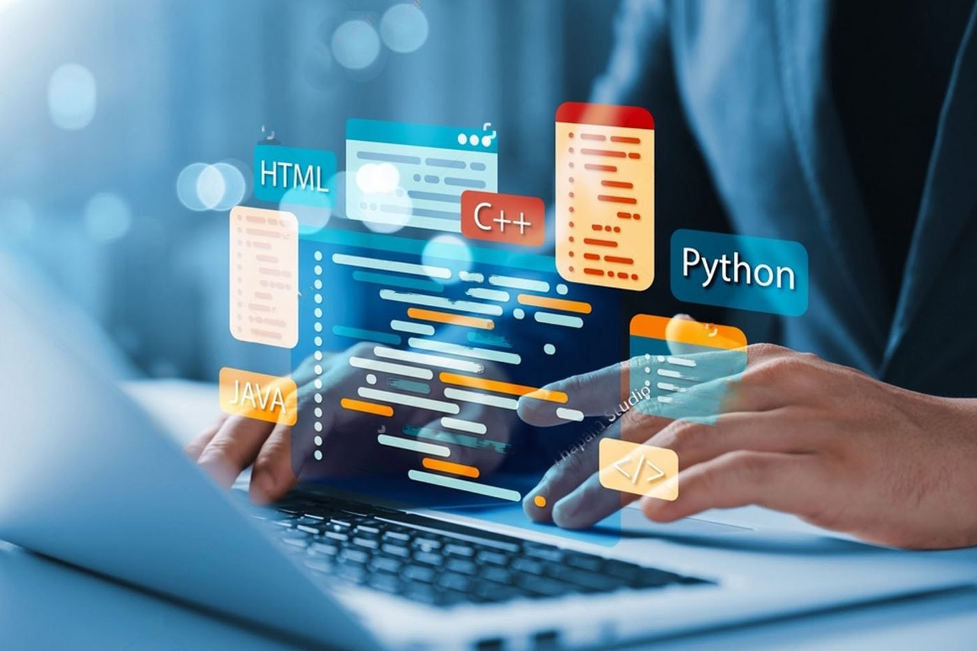 A developer typing code on a laptop