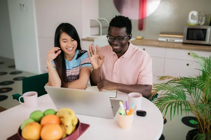 Friendly work meeting over a laptop