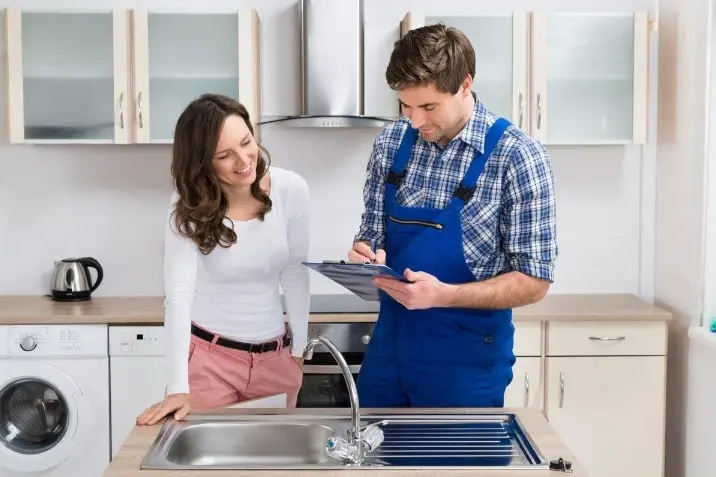 Client and service provider reviewing a kitchen job