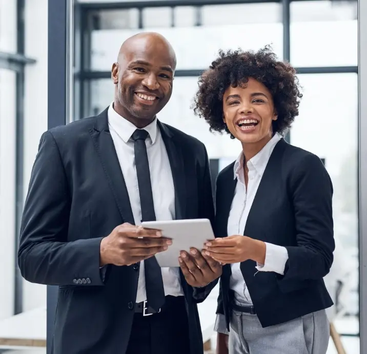 Two partners reviewing a tablet