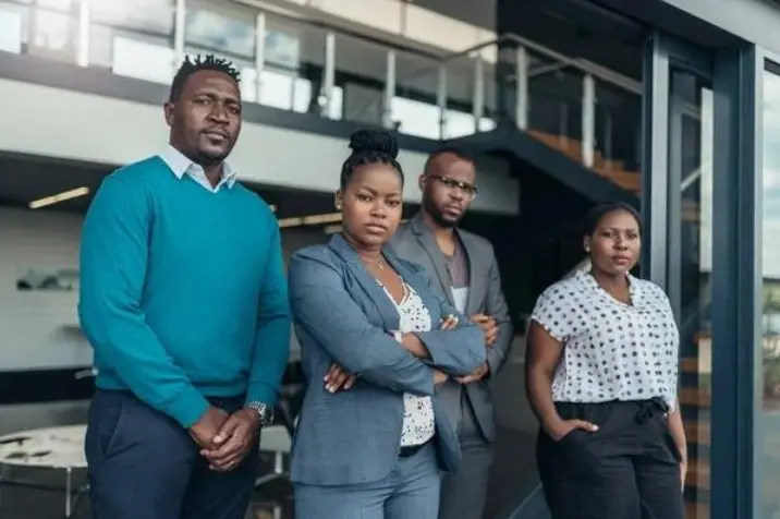 Team of four standing together