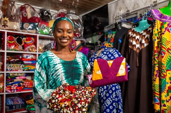 Woman in a colourful fabric shop